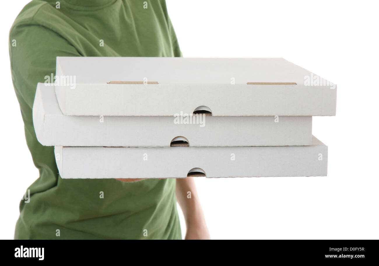 Garçon apportant un carton 3 boîte à pizza, isolé sur fond blanc Banque D'Images