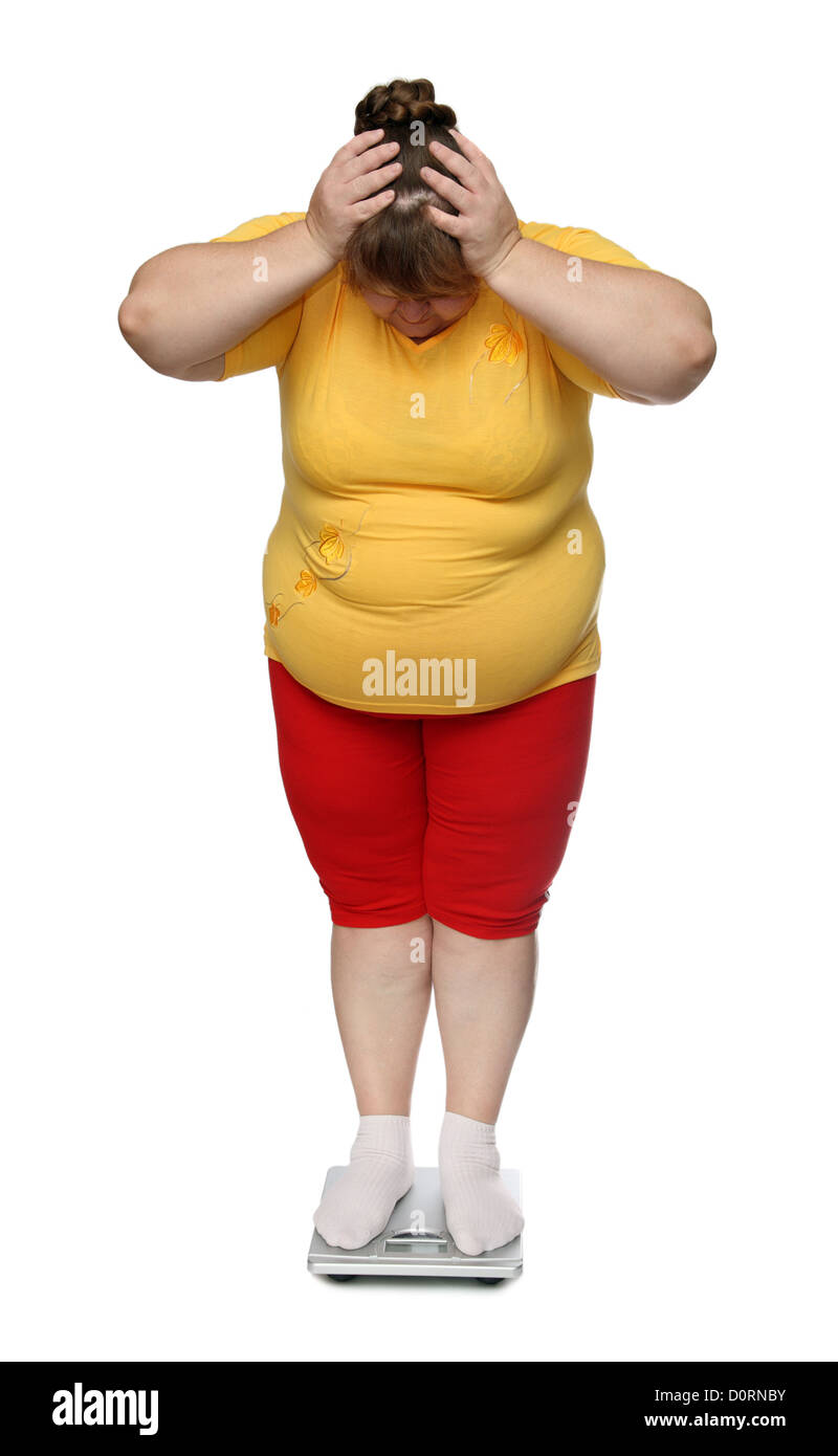 Les femmes à l'excès sur les balances Banque D'Images