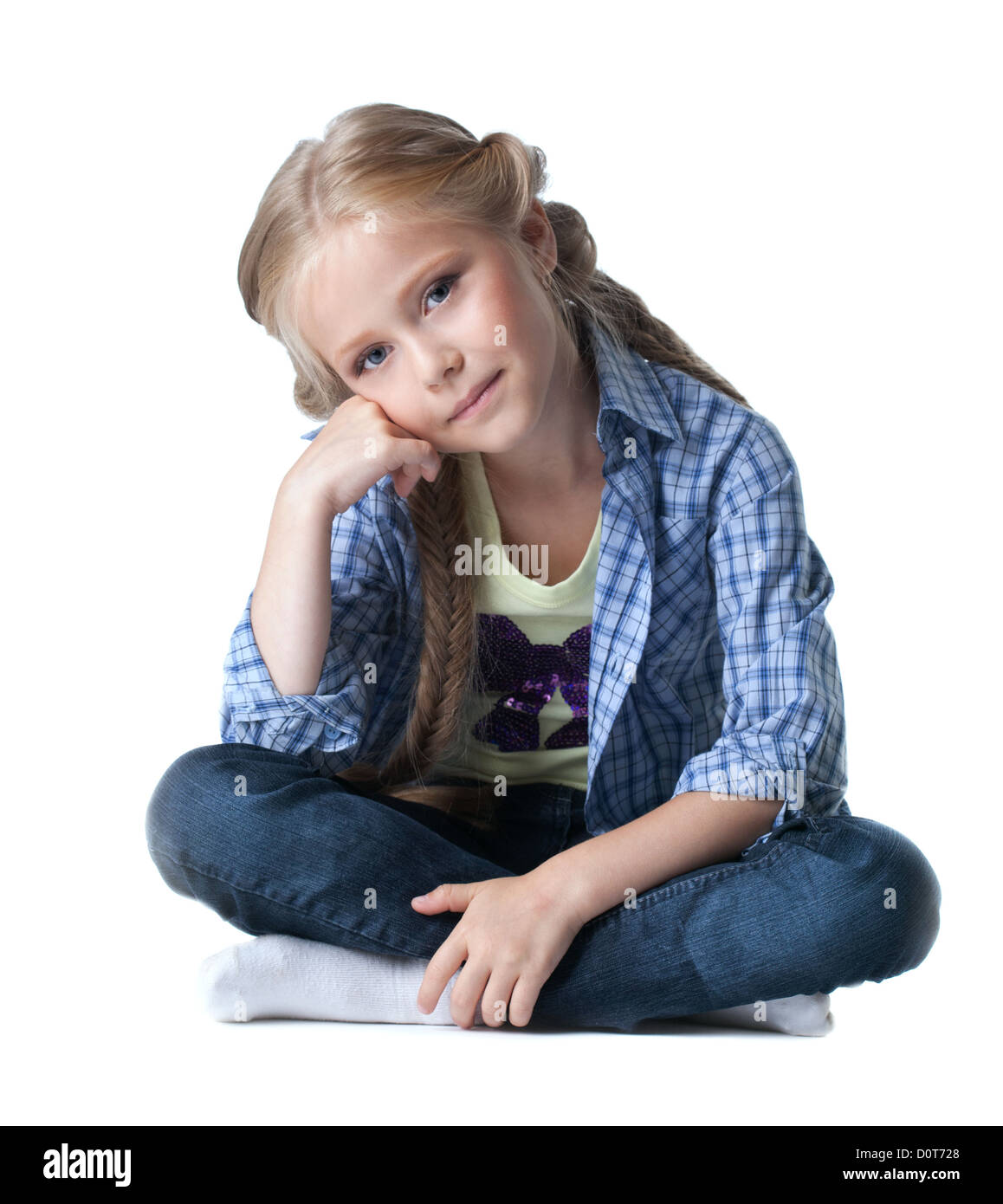 Pretty girl sitting on floor Banque D'Images