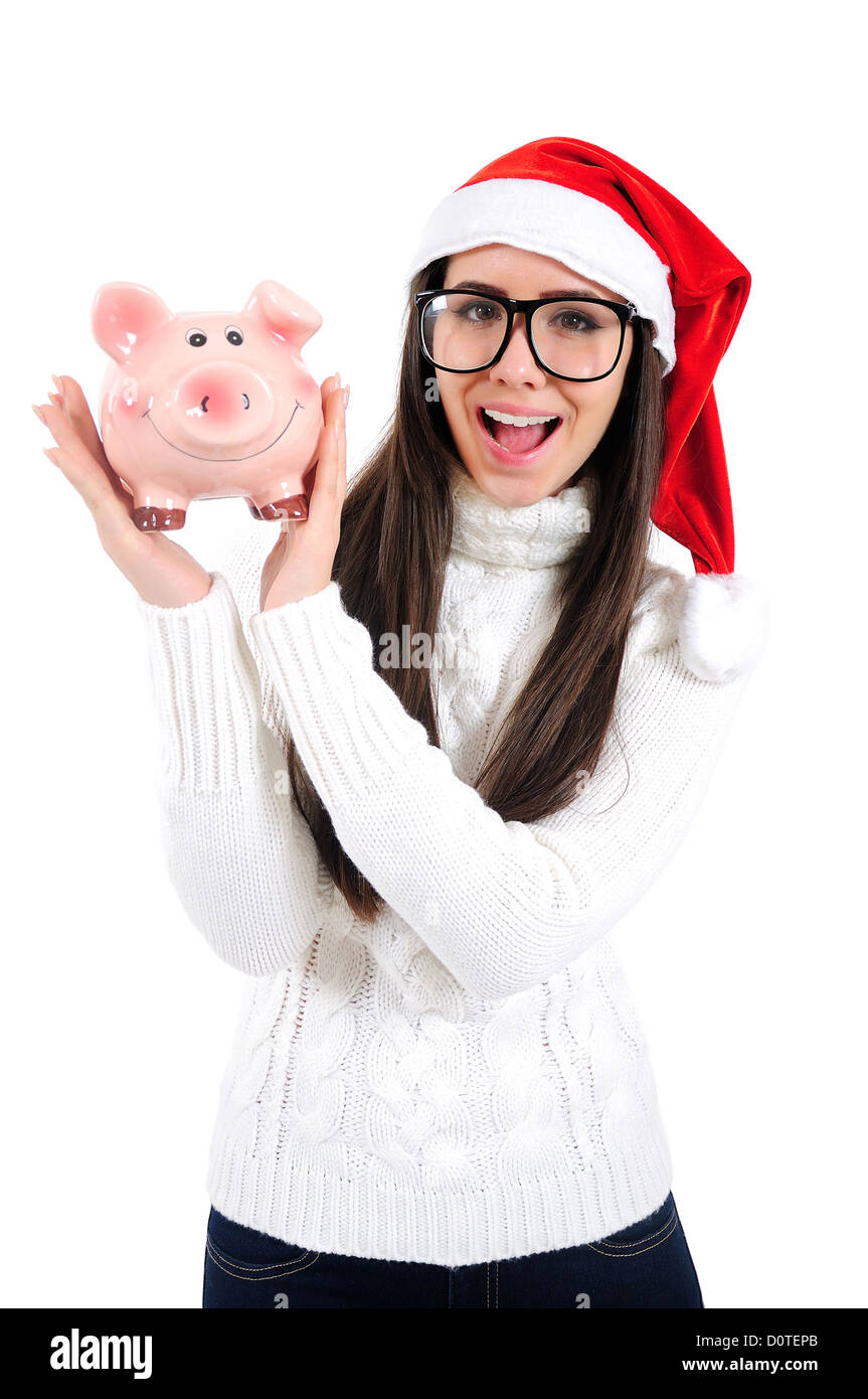 Les jeunes isolés Christmas Girl Holding Piggy Bank Banque D'Images
