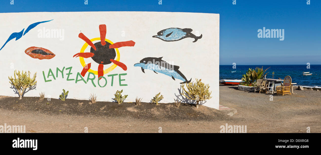 L'Espagne, Lanzarote, Playa Quemada, promotionnels, graffiti, maison, de l'eau, l'été, mer, îles Canaries, Banque D'Images
