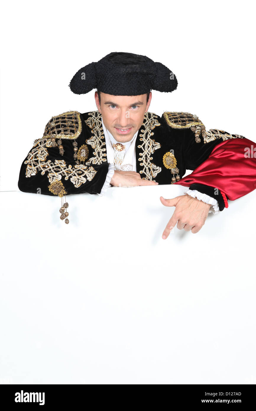 Homme dans un costume matador avec une carte vierge pour texte ou l'image Banque D'Images