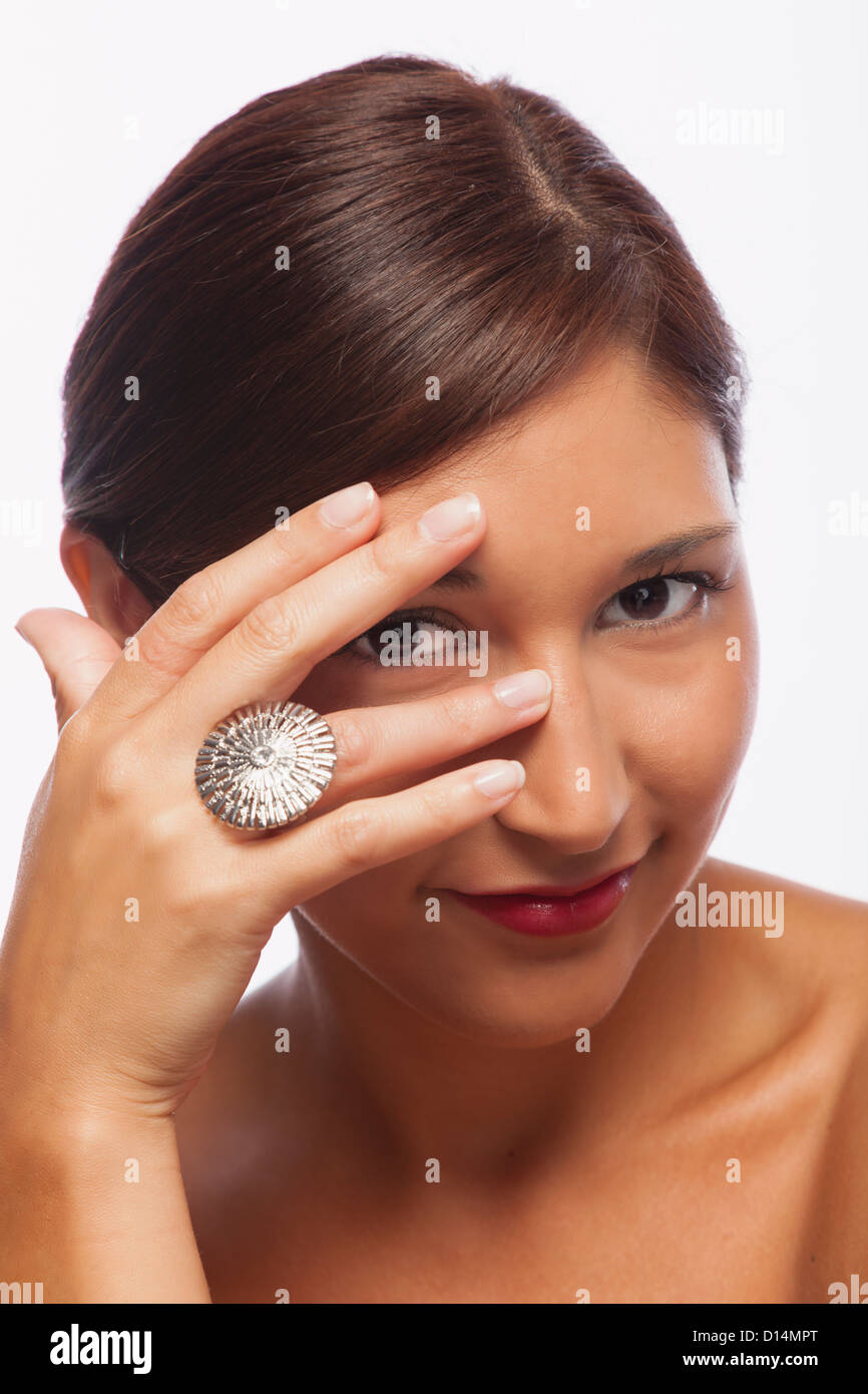 Studio shot of young woman wearing ring Banque D'Images