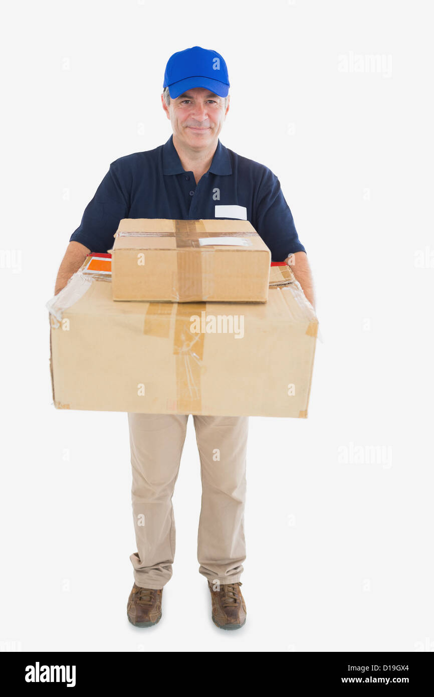 Courier mature man carrying pile de boîtes de carton Banque D'Images