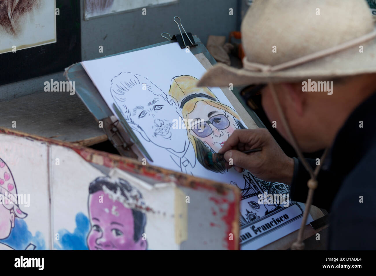 Caricature de rue artiste au travail - San Francisco, California USA Banque D'Images