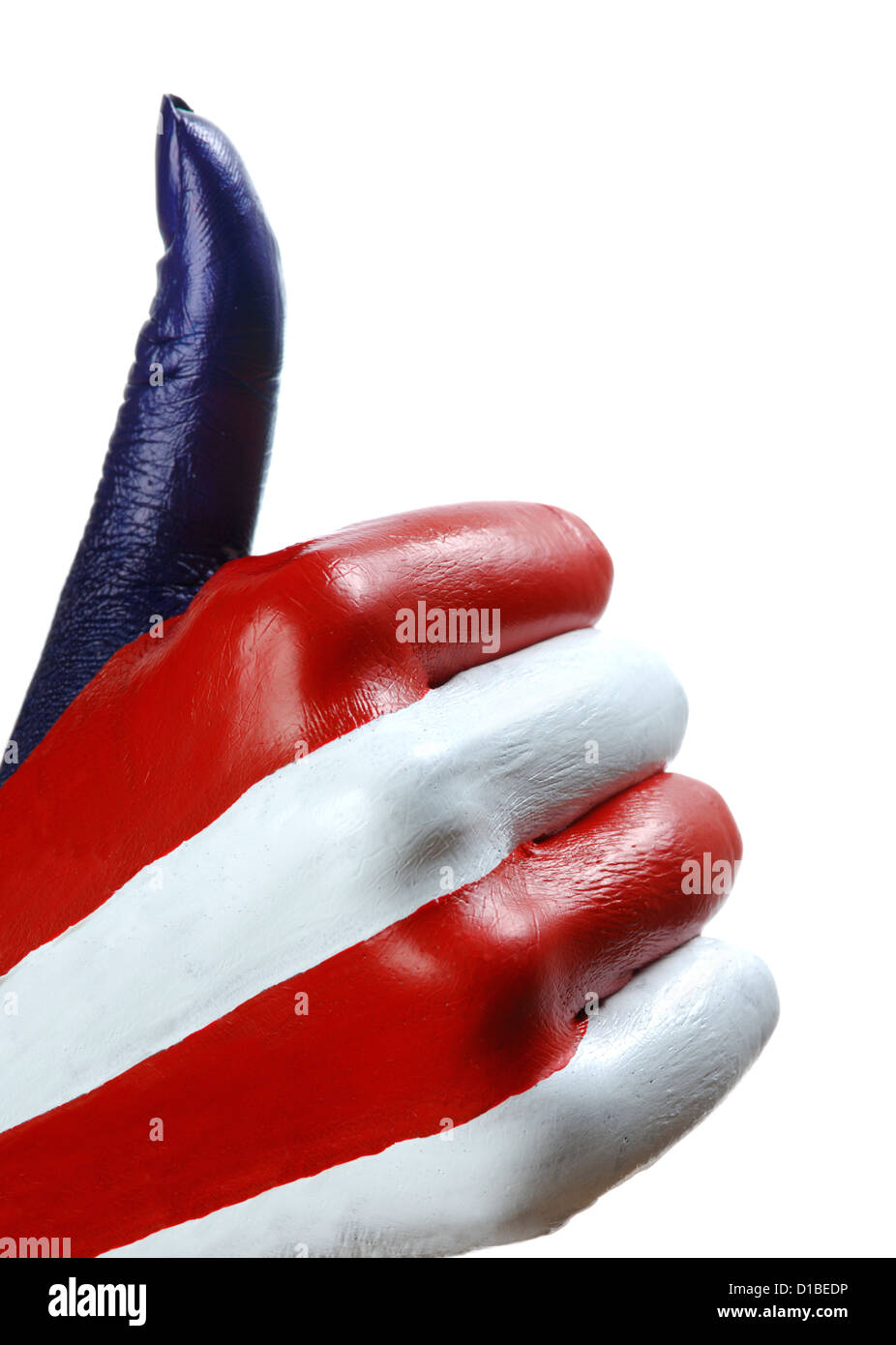 Closeup of American flag painted hand showing Thumbs up geste isolé sur fond blanc Banque D'Images
