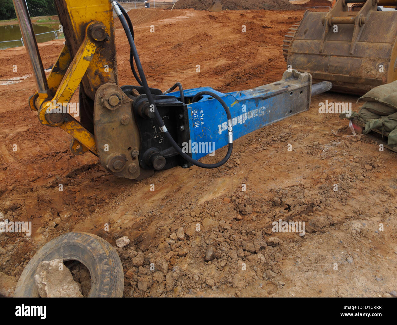 Heavy duty monté pelle marteau hydraulique pneumatique drill point uk road construction site Banque D'Images