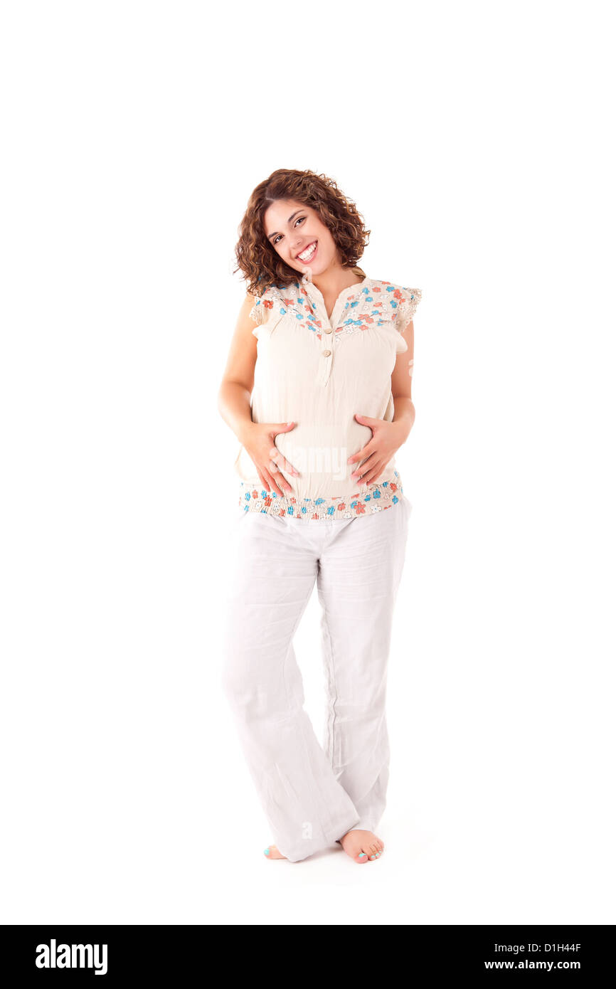 Belle femme enceinte montrant sa bonne forme sur fond blanc Banque D'Images