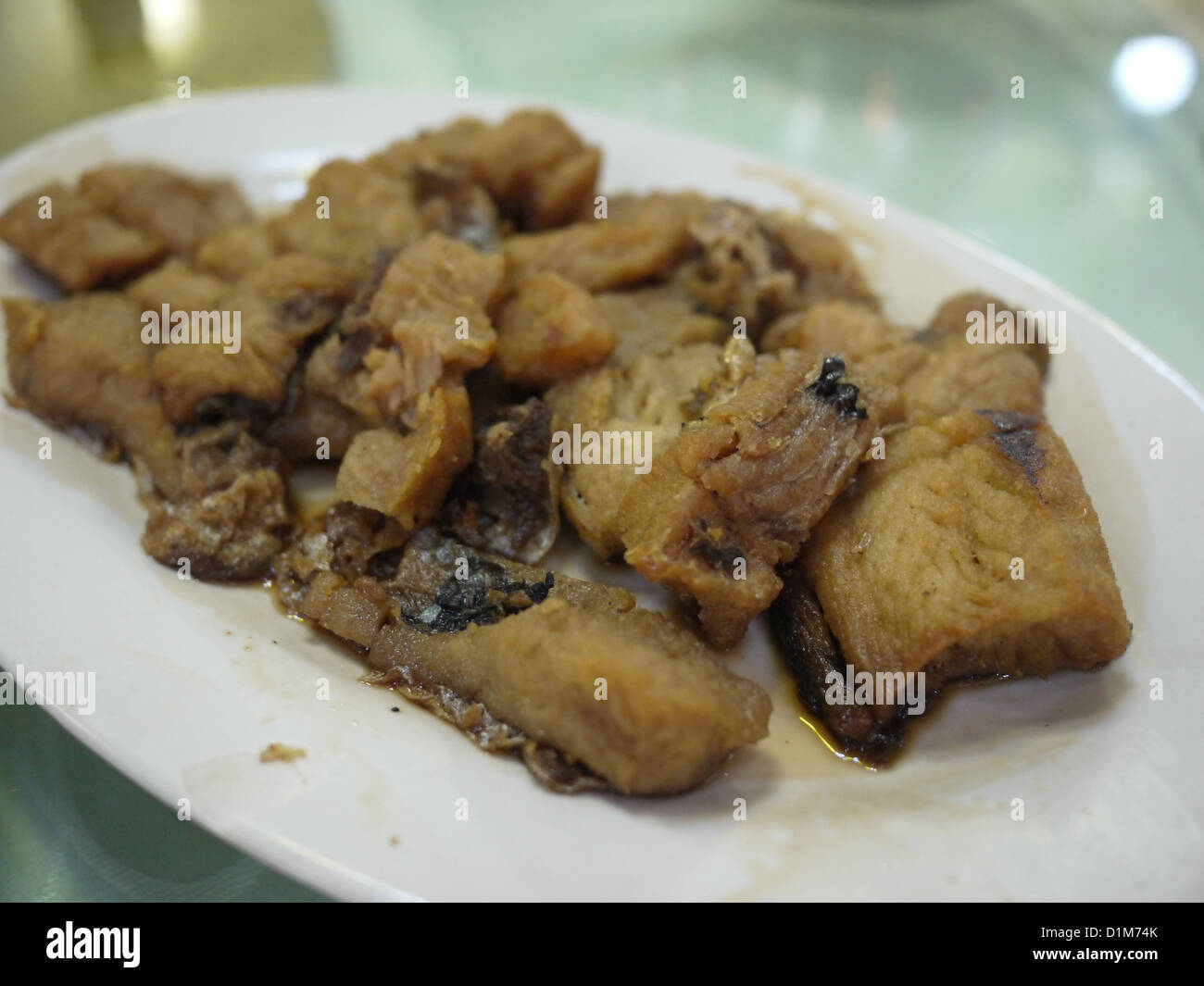Les morceaux de poisson filet frit plat chinois Banque D'Images