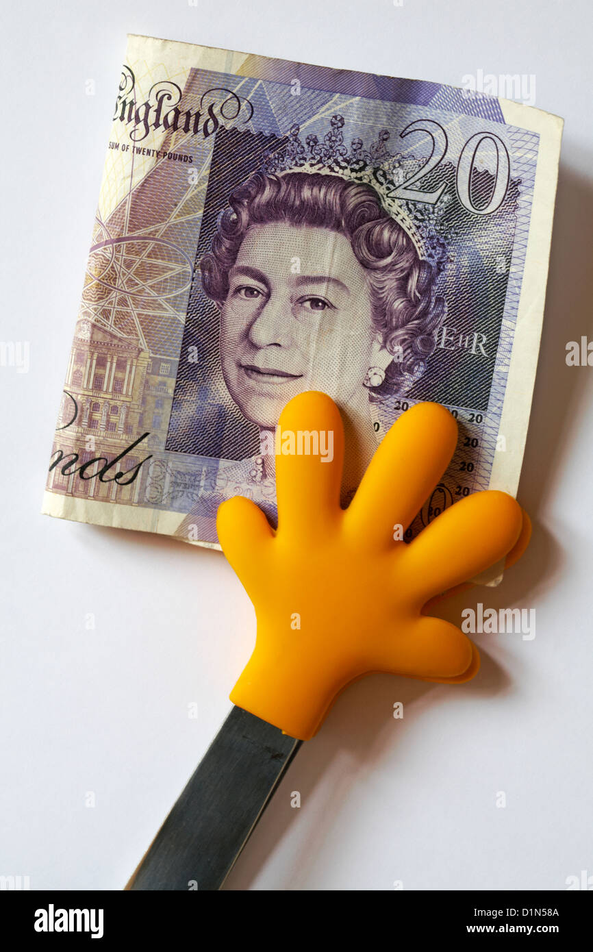 Mains tenant €20 note de l'argent sur fond blanc Banque D'Images