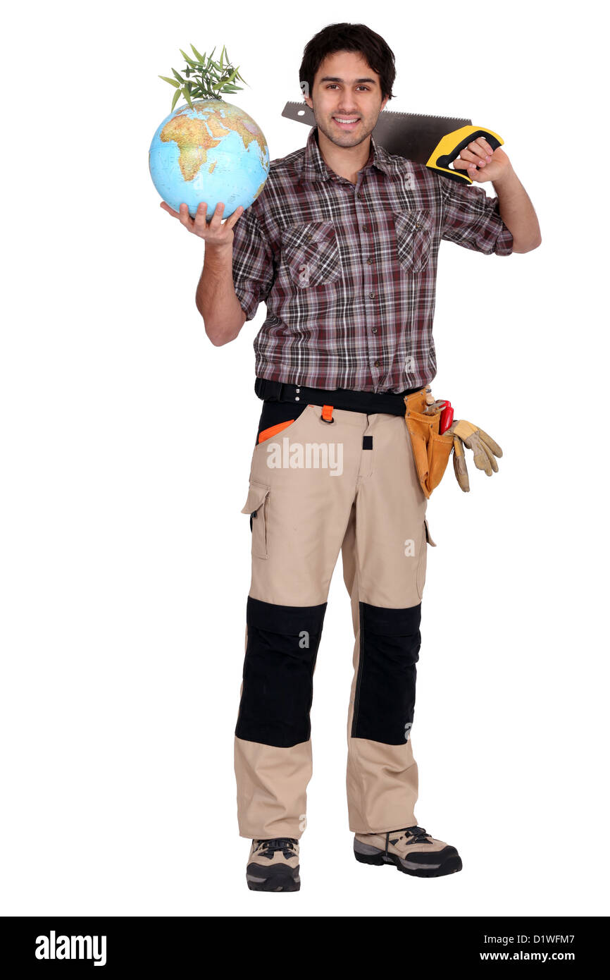 Un carpenter holding a globe Banque D'Images