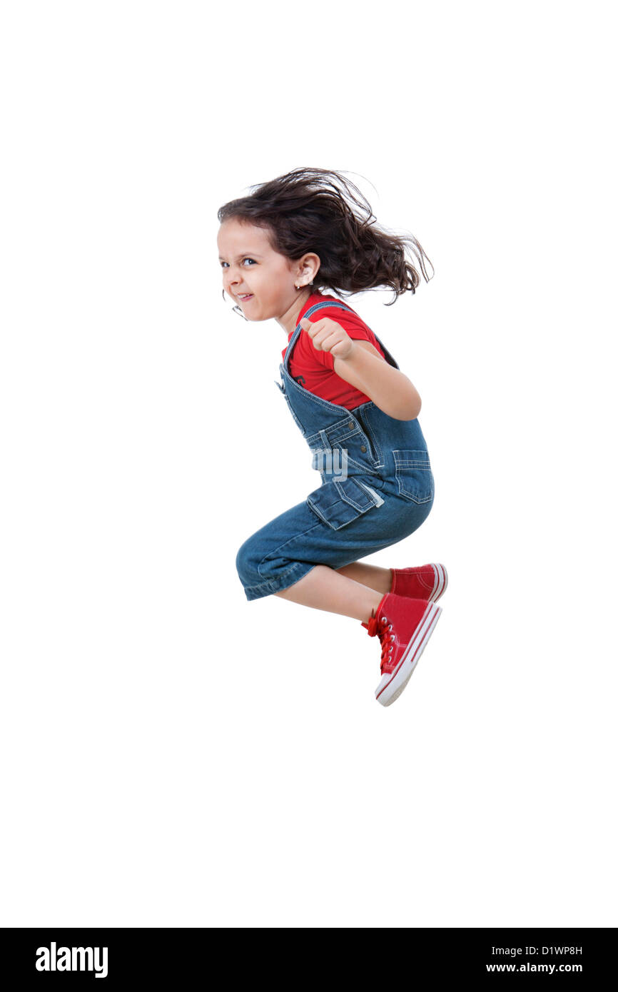 Girl jumping over white background Banque D'Images