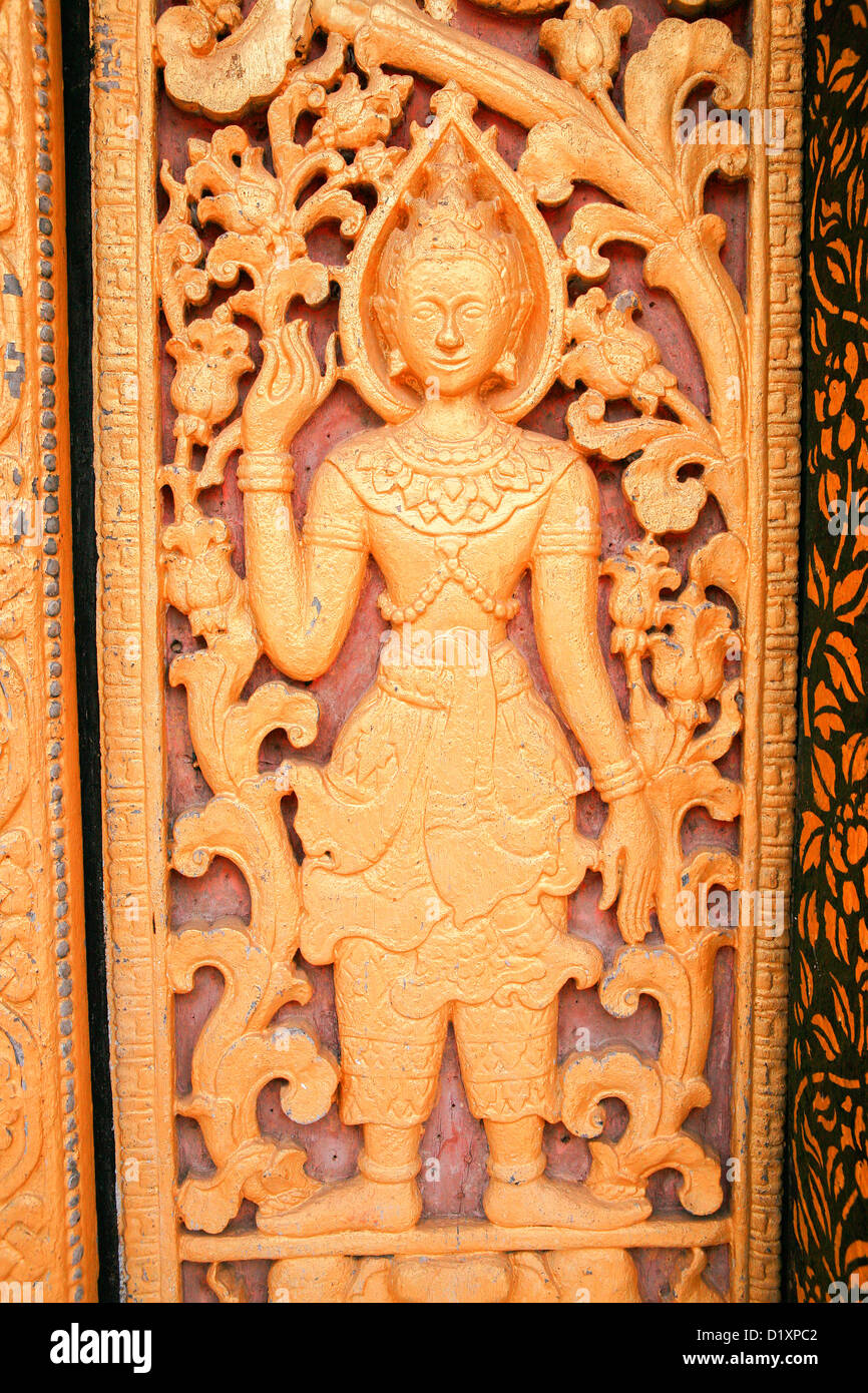 Détail de l'amende à sculptures Wat Xieng Thong à Luang Prabang, Laos du Nord, en Asie du sud-est. Banque D'Images