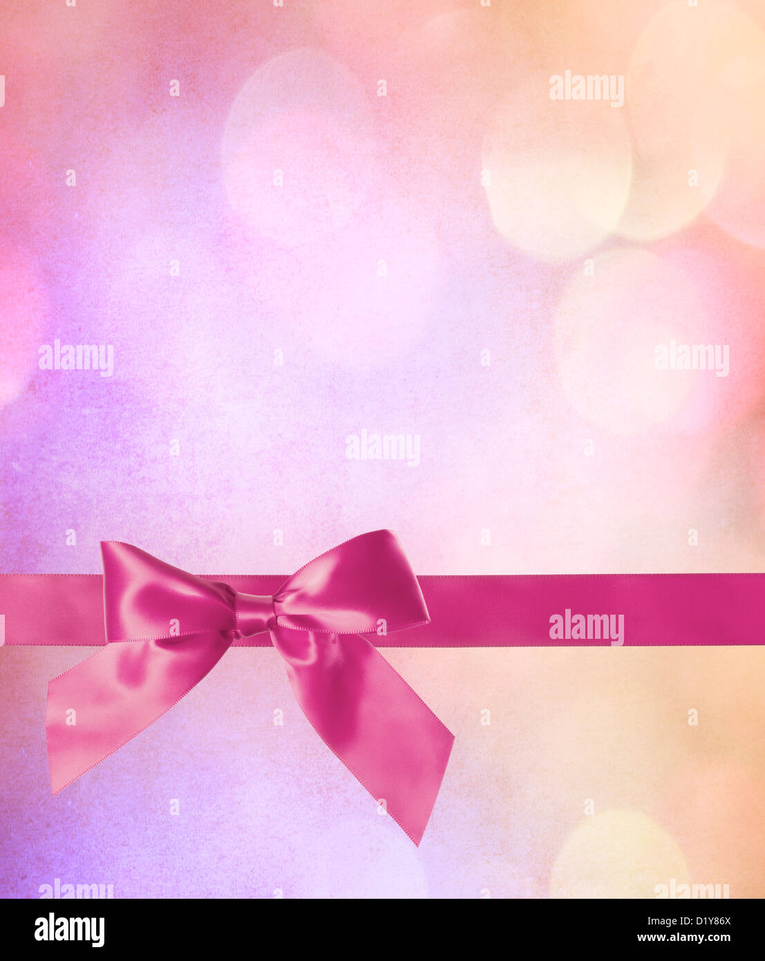 Noeud rose et ruban avec lumières fond abstrait Banque D'Images