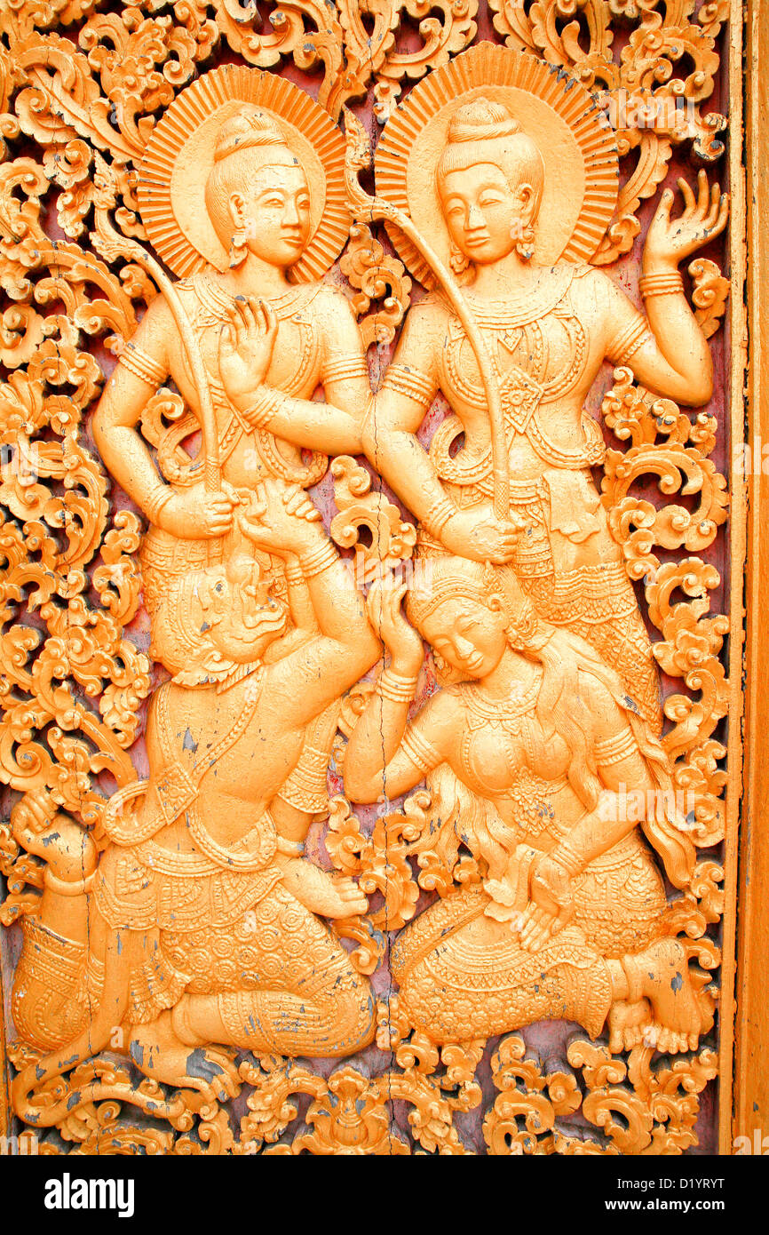 Détail de sculptures fines au Wat Xieng Thong à Luang Prabang, Laos du Nord, en Asie du sud-est. Banque D'Images