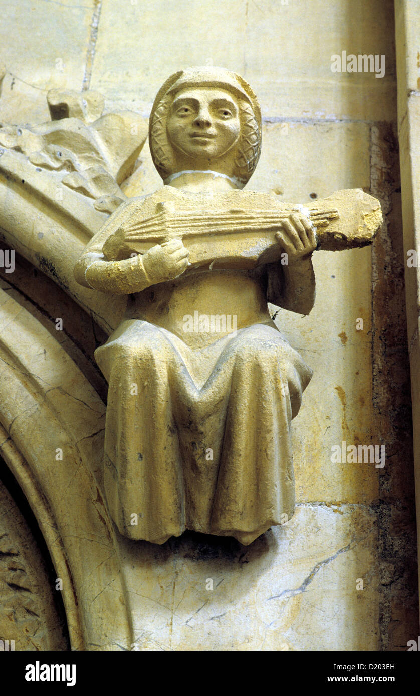 Beverley Minster, cité médiévale en pierre sculpté femme musicien, instrument à cordes, la musique, les musiciens de musique, Yorkshire, Angleterre Royaume-uni Banque D'Images