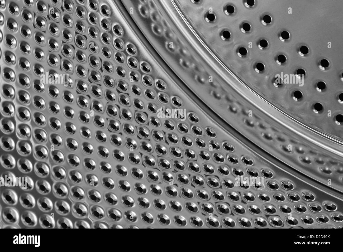 Intérieur en métal brillant d'un tambour de machine à laver de la création d'une base générique Banque D'Images