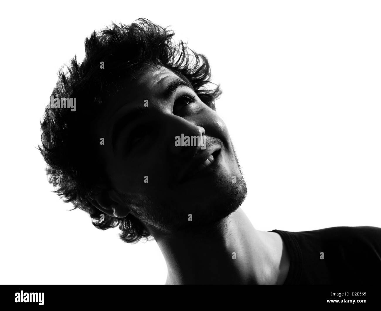 Young man looking up smiling happy woman silhouette en studio isolé sur fond blanc Banque D'Images