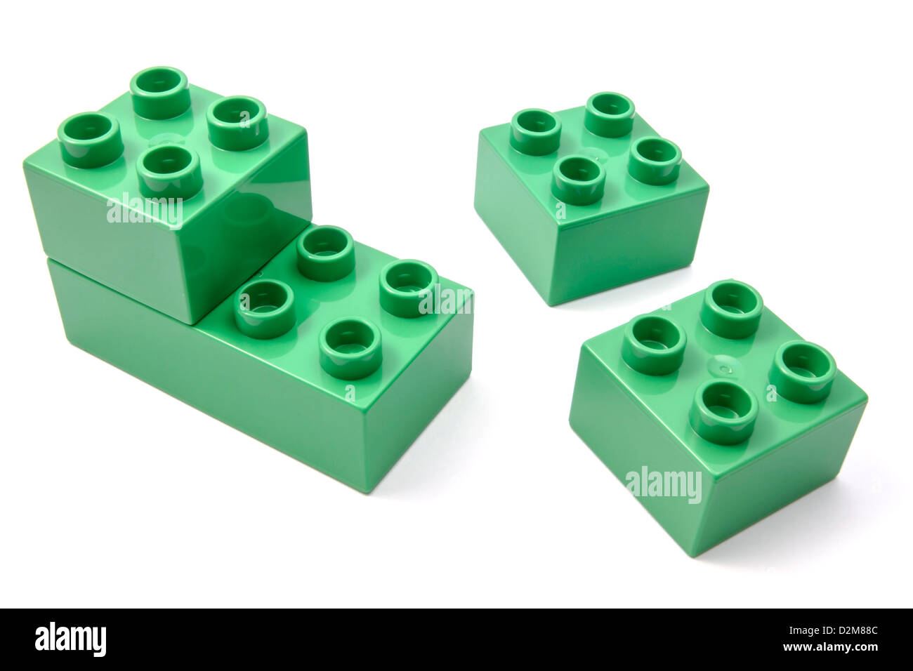 Blocs de construction verte sur fond blanc gros plan Banque D'Images