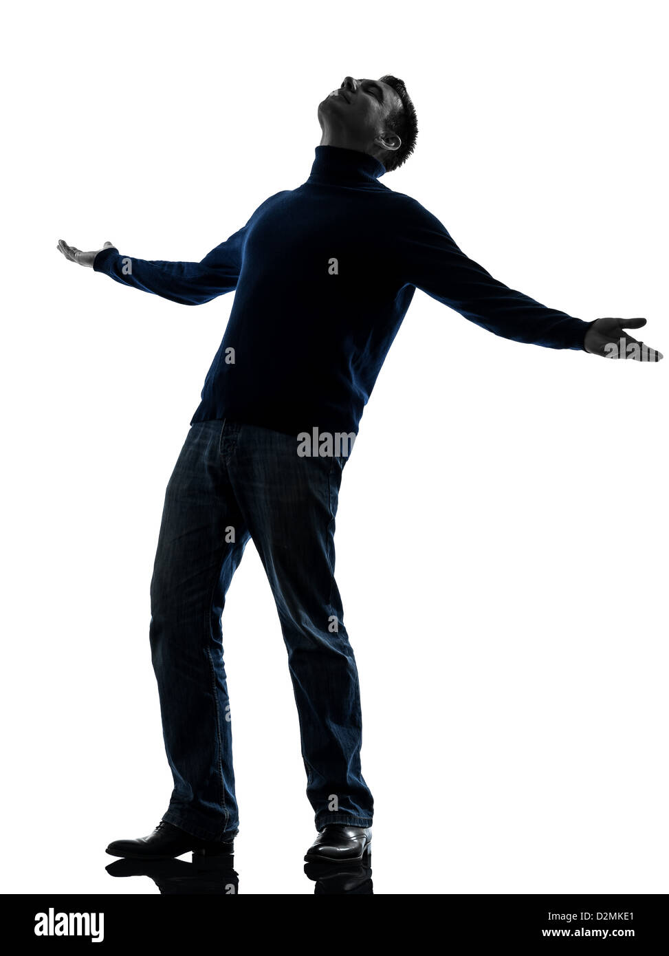 Un homme heureux jusqu'à la longueur totale en silhouette studio isolé sur fond blanc Banque D'Images