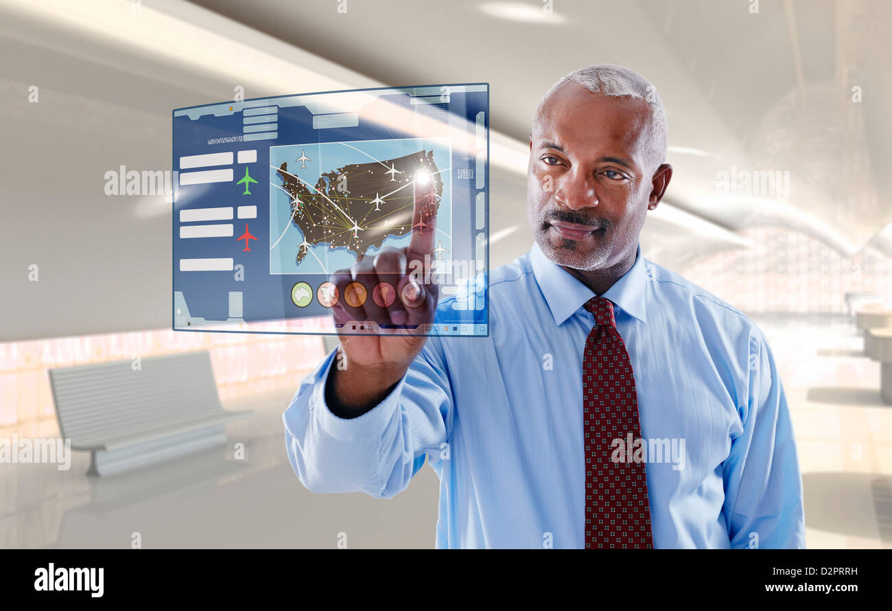 Black businessman using digital display Banque D'Images