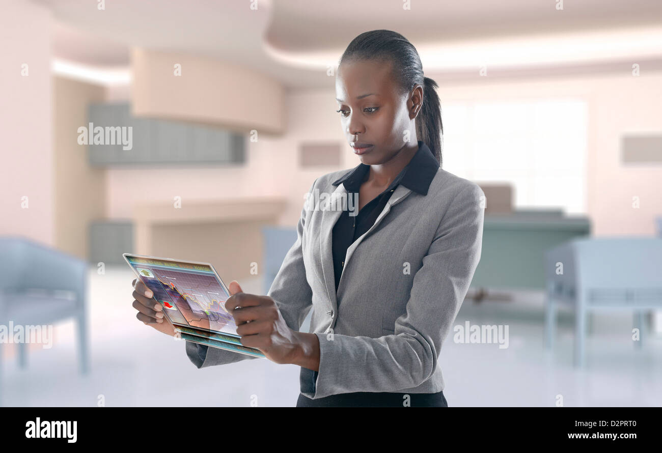 African American businesswoman using digital display Banque D'Images