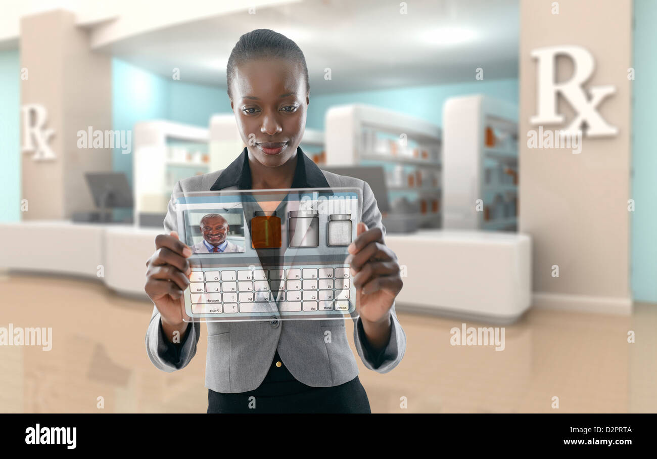 African American businesswoman using digital display en pharmacie Banque D'Images