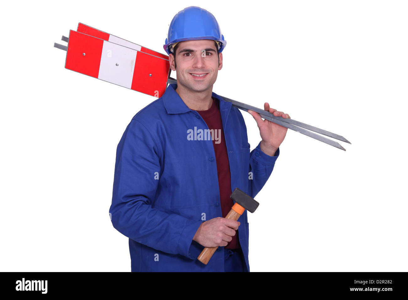 Road worker holding signs et marteau Banque D'Images