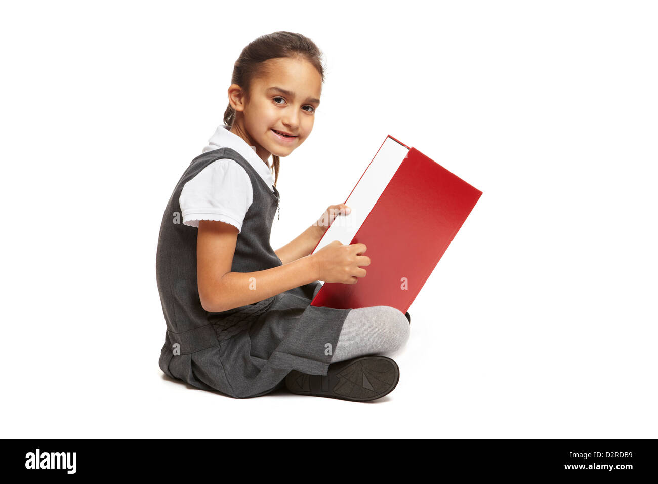 8 an old school girl sitting reading book smiling on white background Banque D'Images