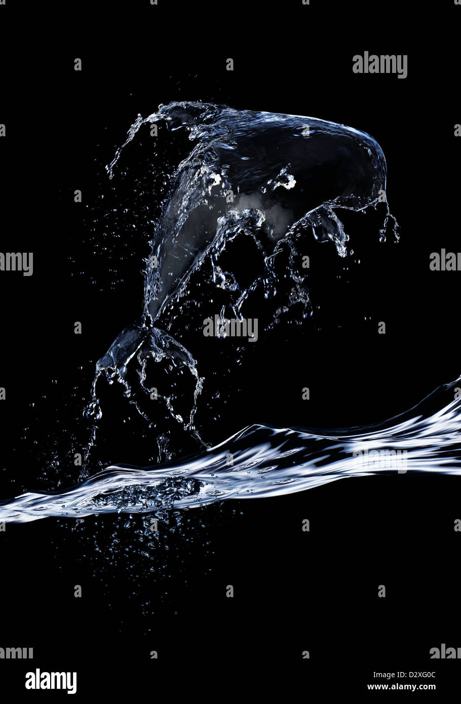 Les éclaboussures d'eau formant dolphin Banque D'Images