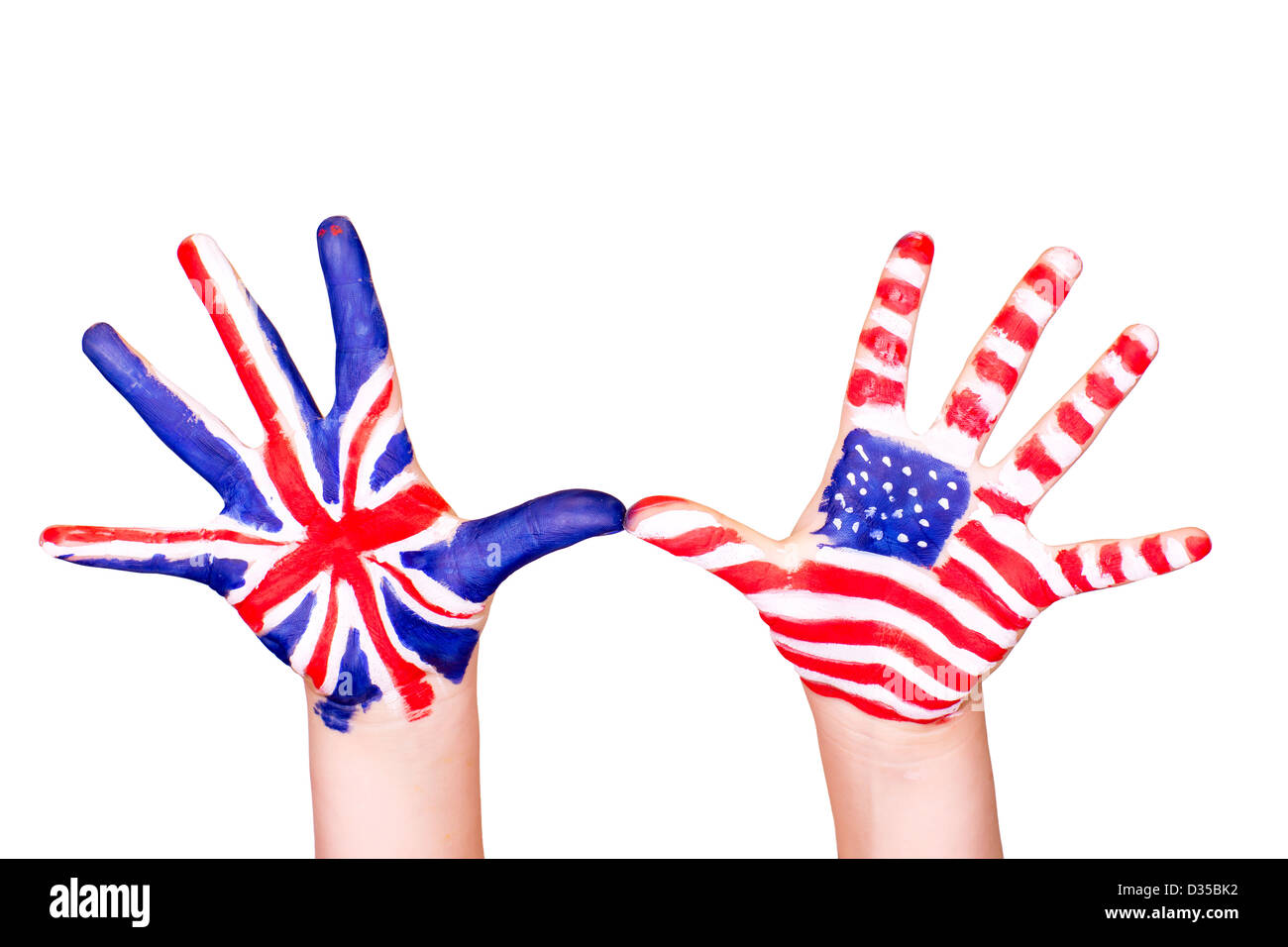 Des drapeaux américains et anglais sur les mains. L'apprentissage de l'anglais langue concept. Banque D'Images