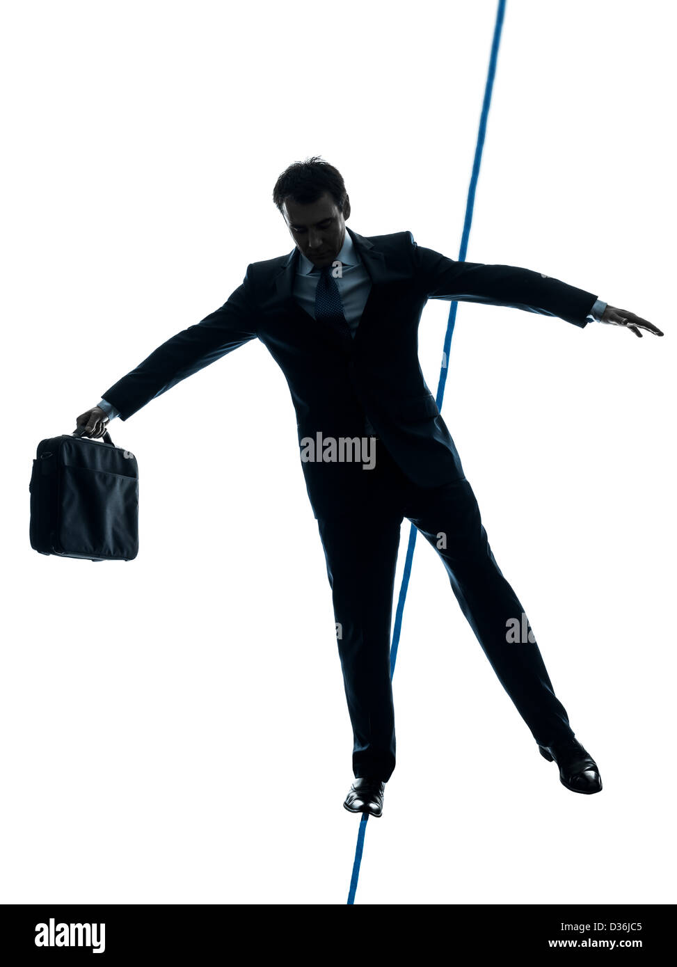 Un homme d'équilibristes en silhouette studio isolé sur fond blanc Banque D'Images