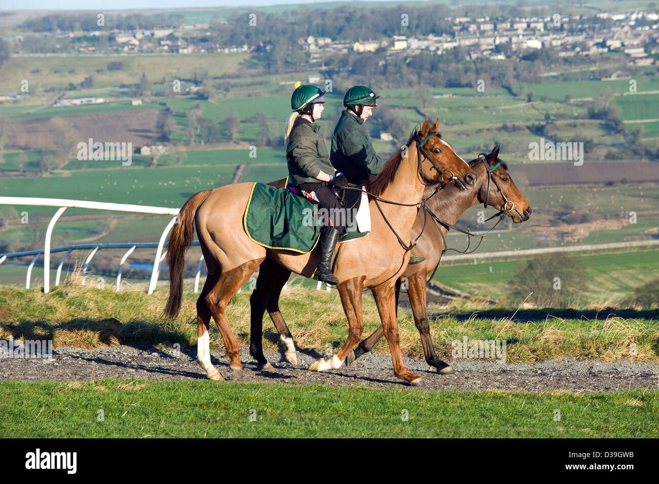 Phil Kirby entraîneur de chevaux de course, début de matinée ride out. Banque D'Images