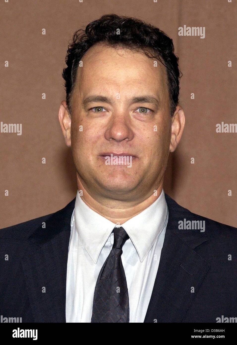 (Afp) - L'acteur américain Tom Hanks, photographié au cours de la présentation de son nouveau film 'Road to Perdition' à Berlin, Allemagne, 29 août 2002. Dans le film de gangsters 46 ans Hanks agit comme un père qui travaille comme killer à l'appui de sa famille. Banque D'Images