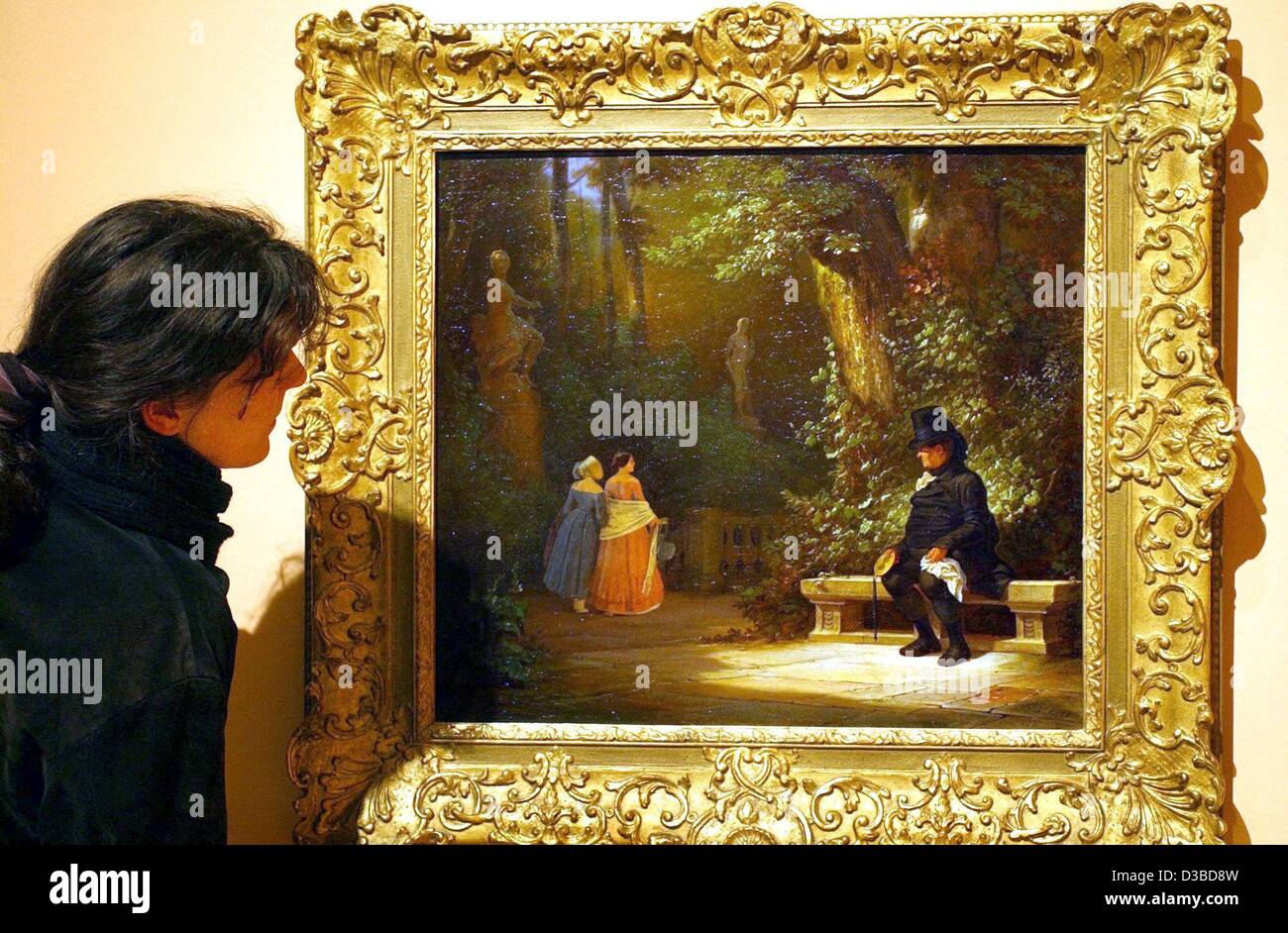 (Afp) - Un visiteur regarde la peinture 'Der Witwer' (le veuf) par Carl Spitzweg (1808-1885), Munich, le 23 janvier 2003. Une exposition de 250 de ses peintures se tient à Munich, Haus der Kunst (Maison d'art) du 23 janvier au 18 mai 2003. Les tableaux de Spitzweg représentent le "bon vieux temps" un Banque D'Images