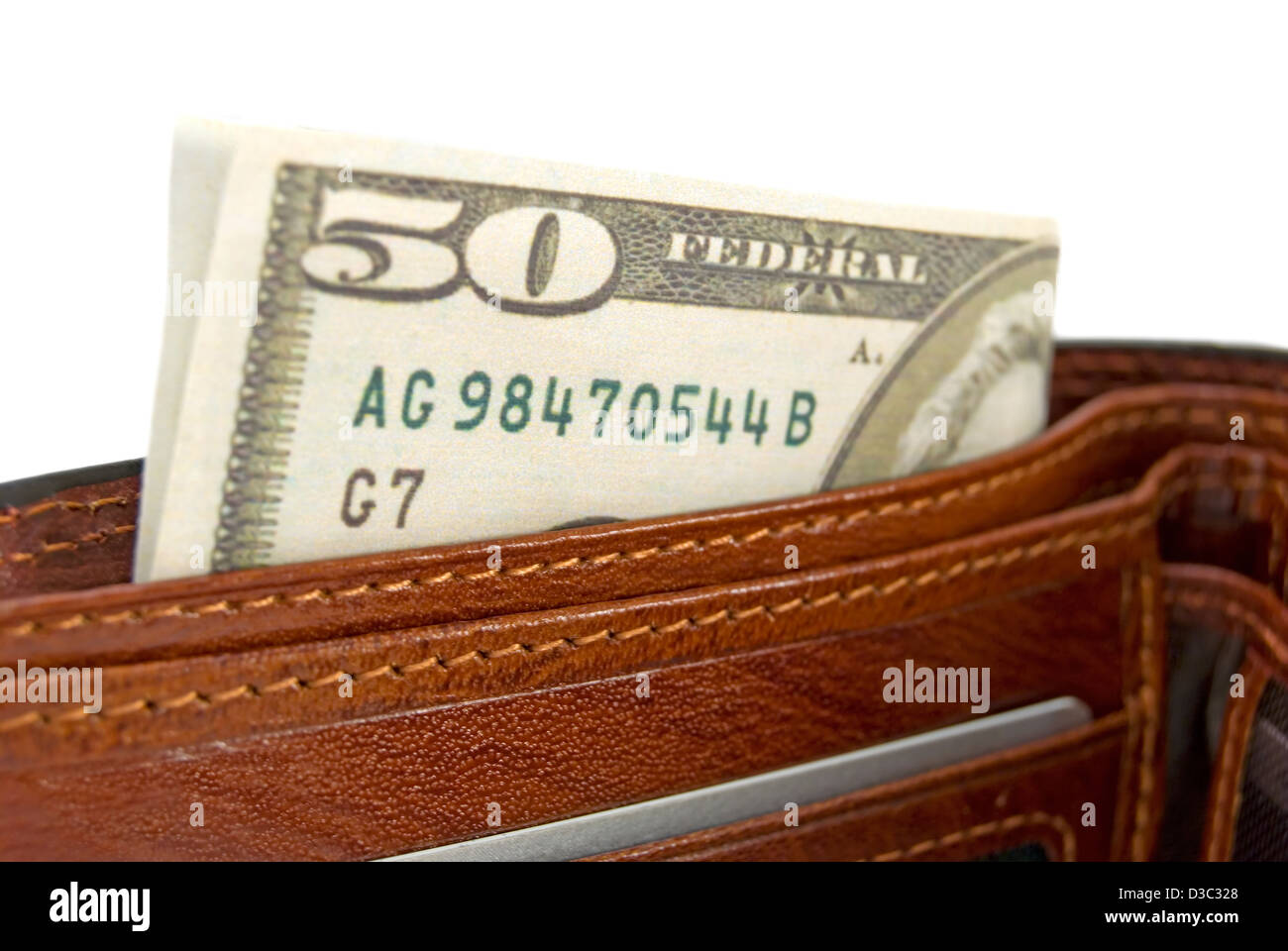 Le sac à main marron avec de l'argent est photographié un close-up Banque D'Images