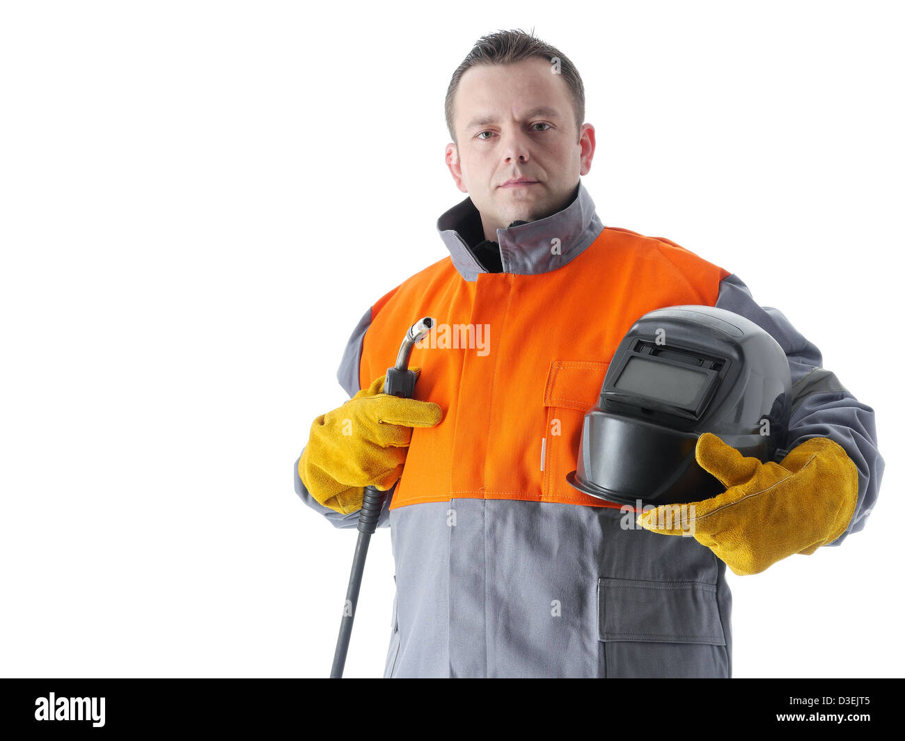 Le port de vêtement de protection soudeur soudure tenant le capot et fer à souder à gaz on white Banque D'Images