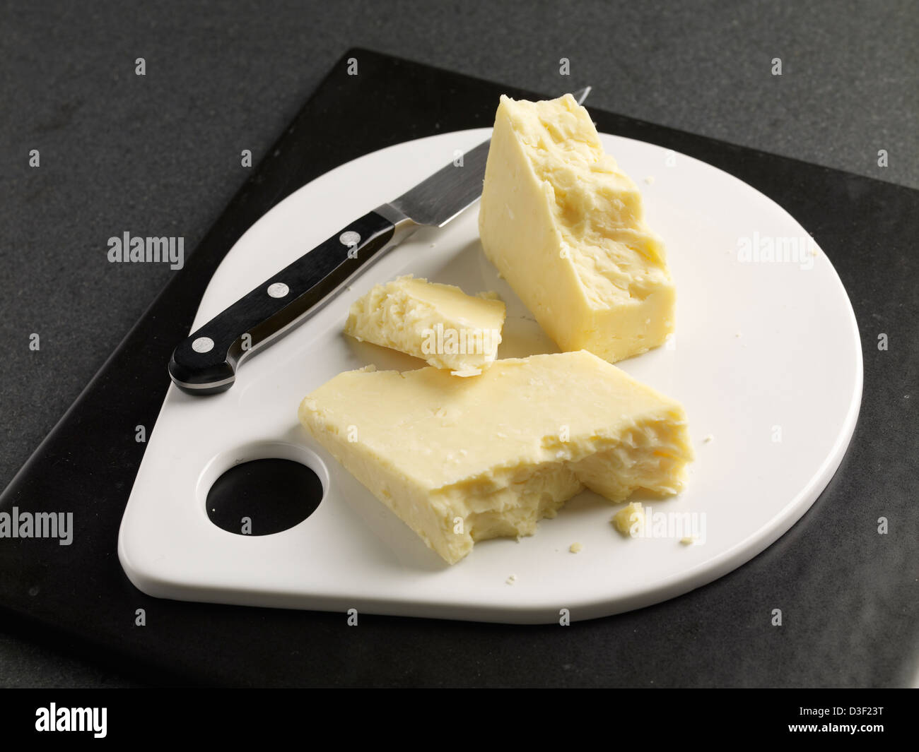 Morceaux de fromage Gratteuse Devon Banque D'Images