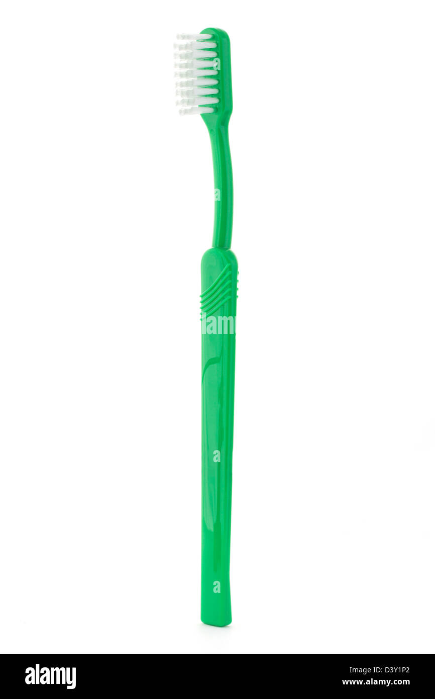 Brosse à dents verte sur un fond blanc Banque D'Images