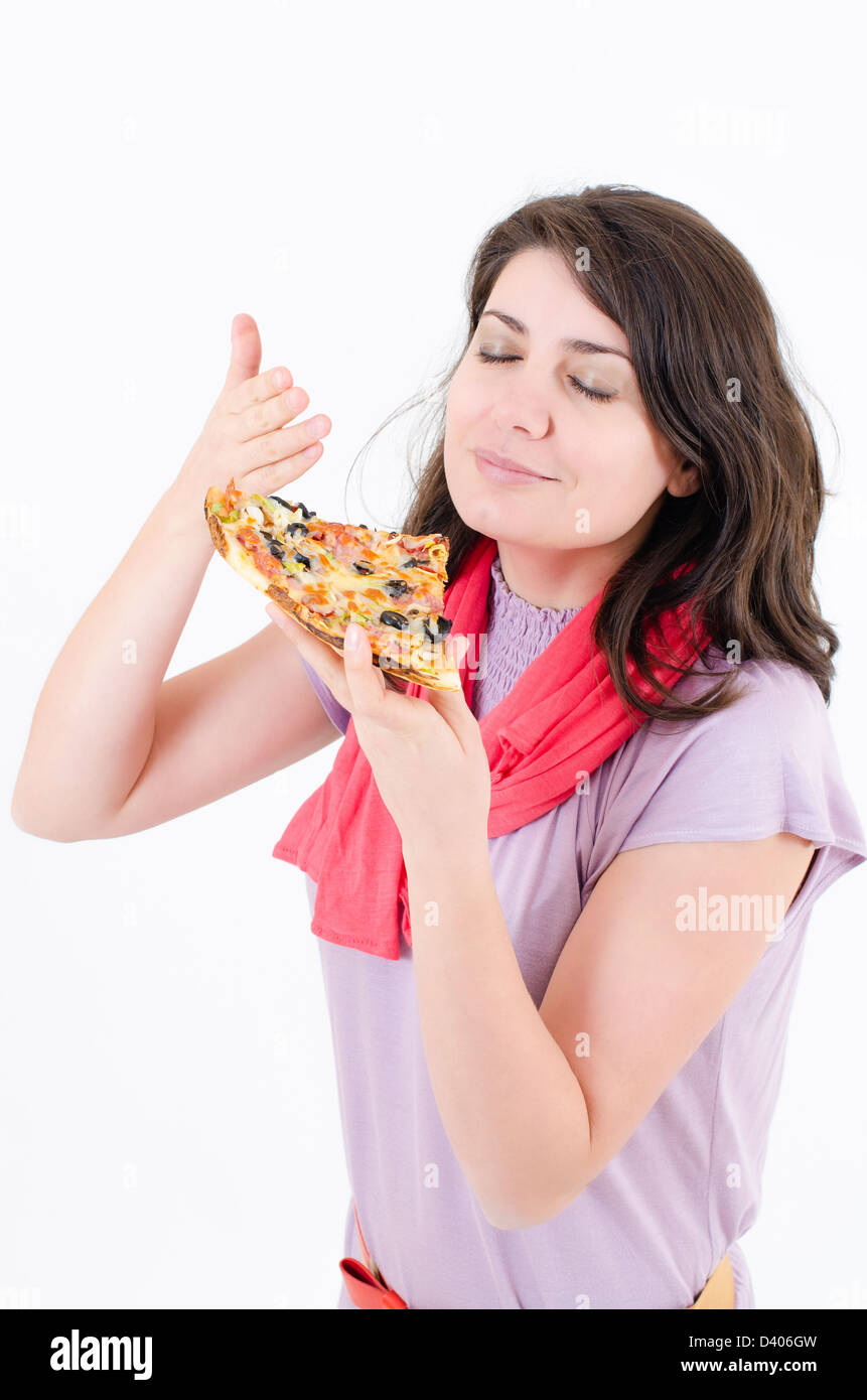 A woman eating pizza isolated on white Banque D'Images