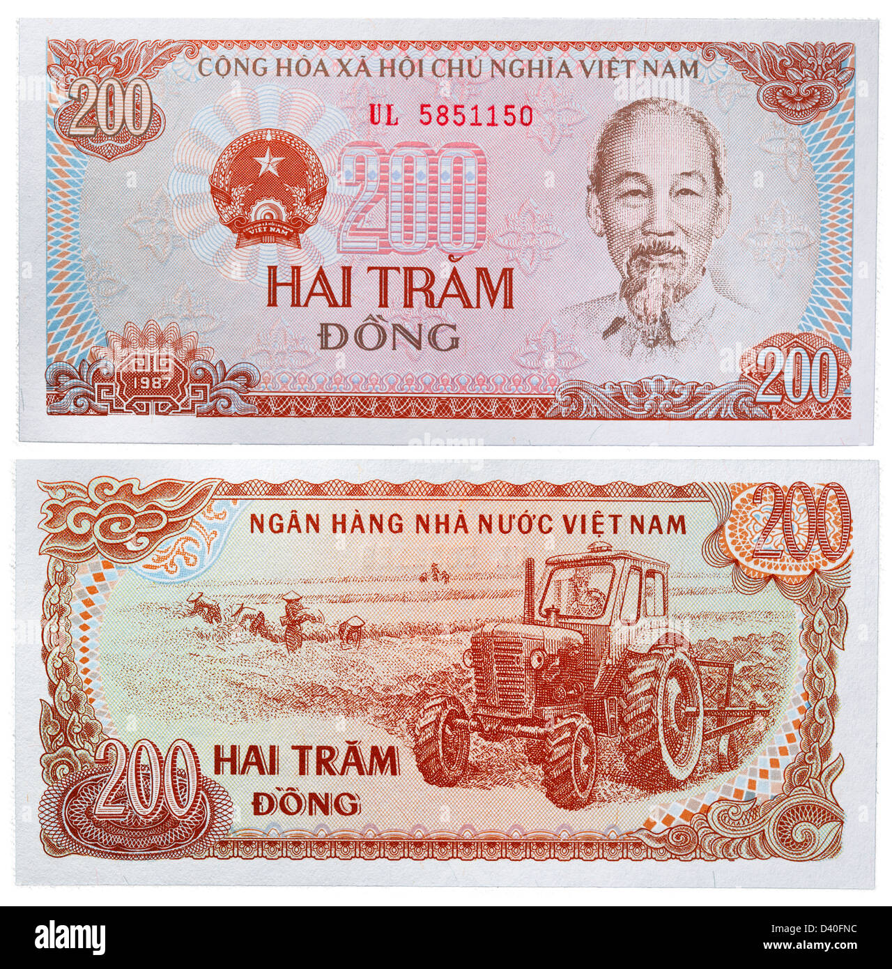 Billet de 200 Dong, Ho Chi Minh et de travailleurs sur le terrain avec le tracteur, Vietnam, 1987 Banque D'Images