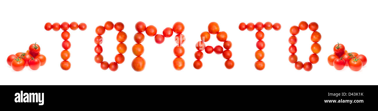 Le mot 'TOMATO' du rouge tomates mûres sur blanc Banque D'Images