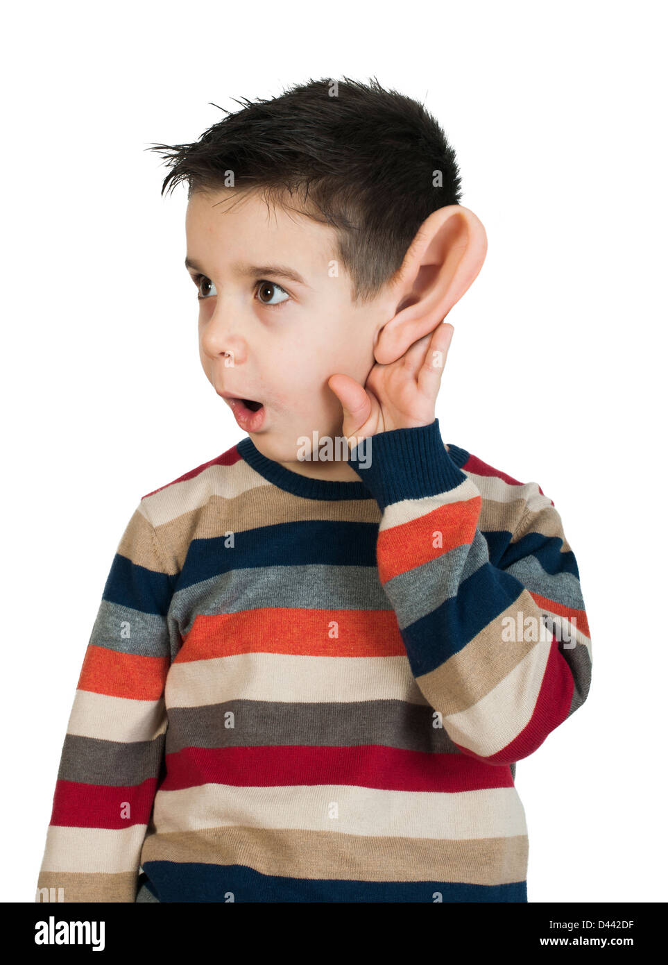 L'écoute de l'enfant avec l'oreille. Isolé blanc studio shot Banque D'Images