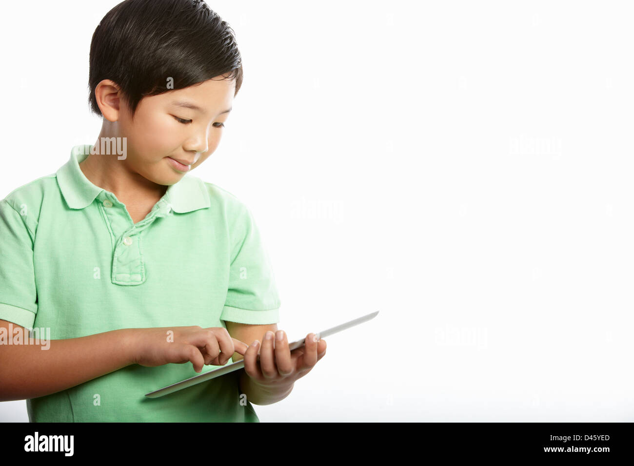 Studio Shot of Chinese Boy With Digital Tablet Banque D'Images