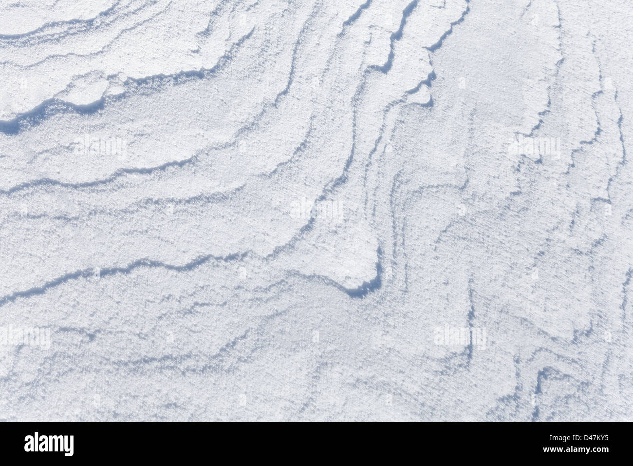 Résumé fond texture de Snowdrift avec de belles ombres courbées Banque D'Images