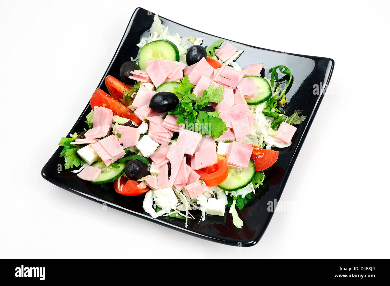 Plaque noire, avec de la salade et du jambon Banque D'Images