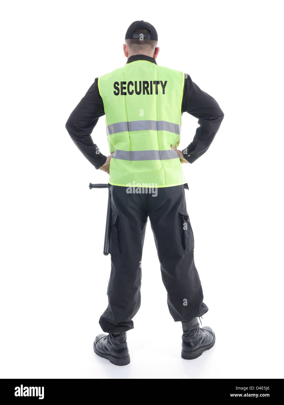 Homme portant de sécurité uniforme noir et jaune gilet réfléchissant avec les bras en toute confiance permanent reposant sur les hanches, face à l' arrière Banque D'Images
