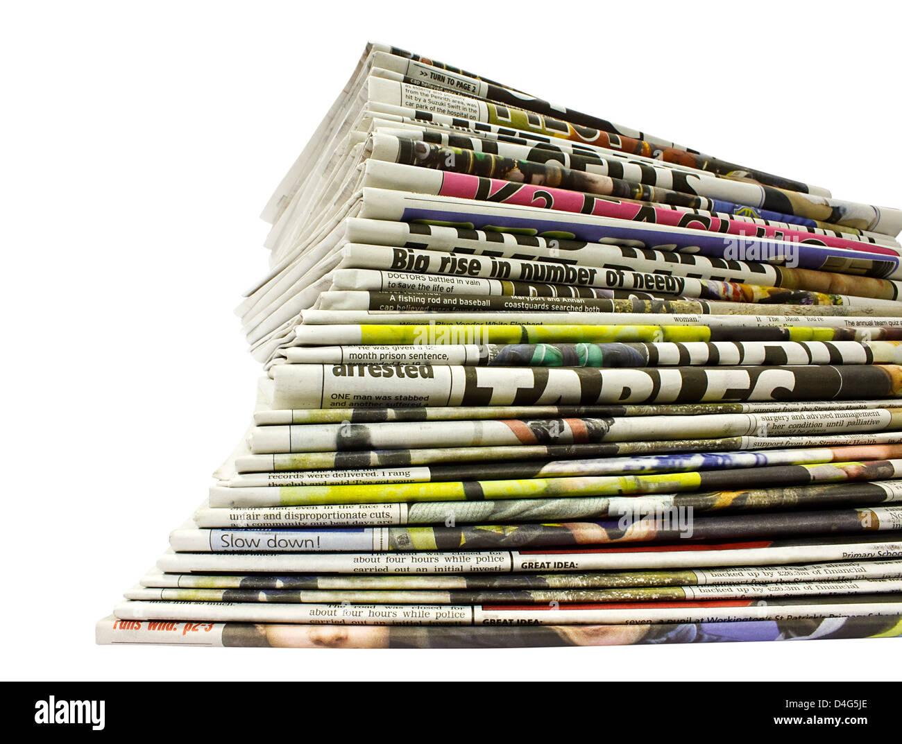 Collection de journaux de différentes couleurs empilées en tas isolated on white Banque D'Images