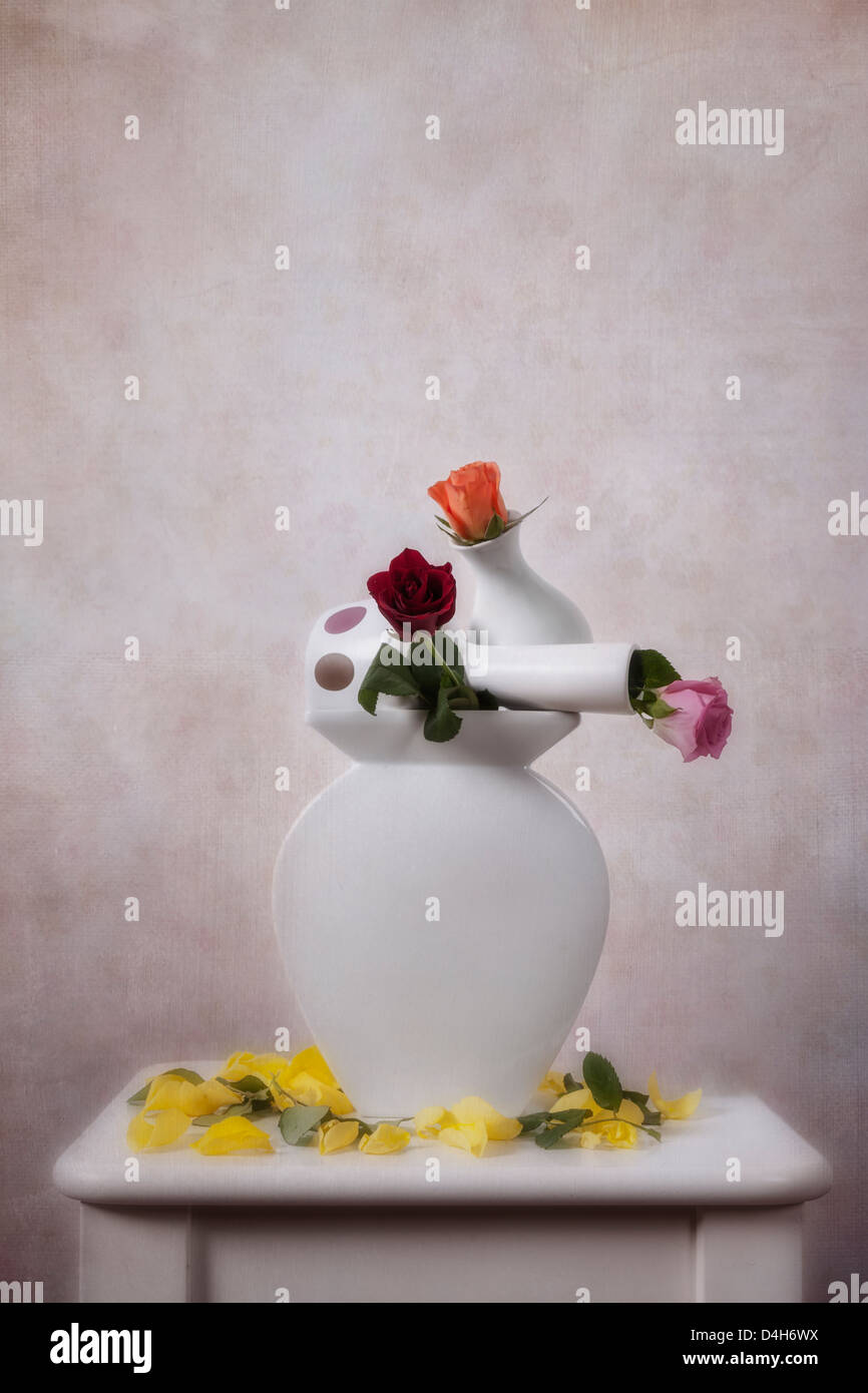 3 vase à fleurs roses avec empilés Banque D'Images