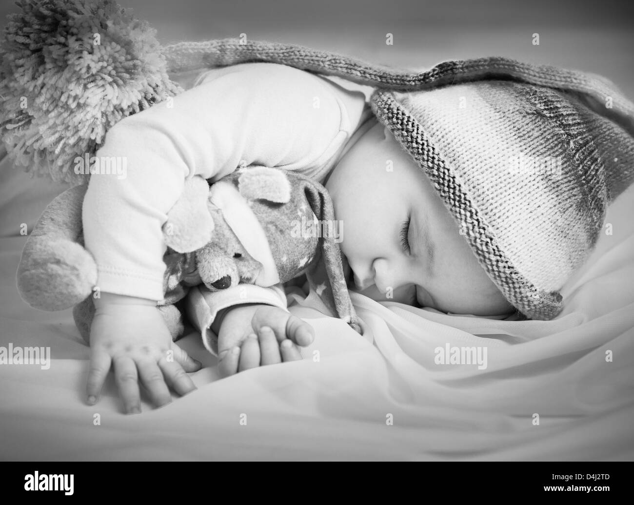 Baby Girl sleeping with toy Banque D'Images